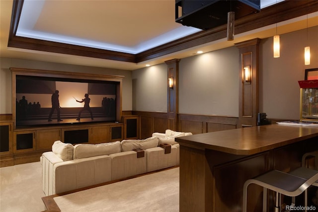 5470 S Highline Cir, Greenwood Village, CO 80121 - home theater room featuring a raised ceiling, light carpet, ornate columns, and a wainscoted wall
