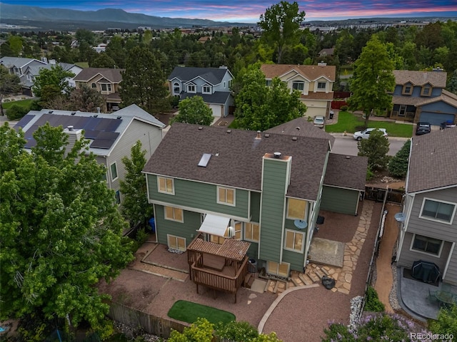 2035 Springcrest Rd, Colorado Springs, CO 80920 - aerial view at dusk of a residential view and a mountain view