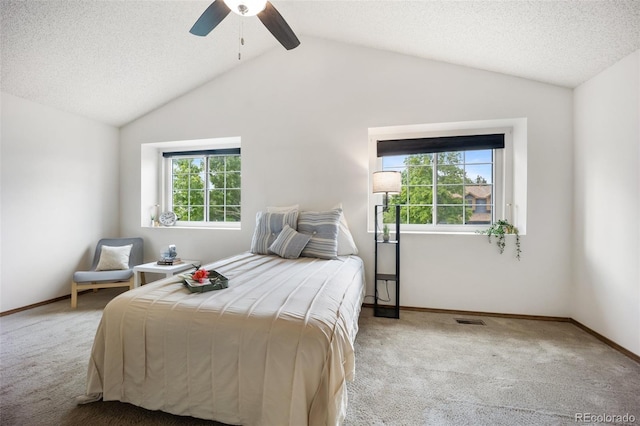 2035 Springcrest Rd, Colorado Springs, CO 80920 - bedroom featuring carpet floors, multiple windows, vaulted ceiling, ceiling fan, and a textured ceiling