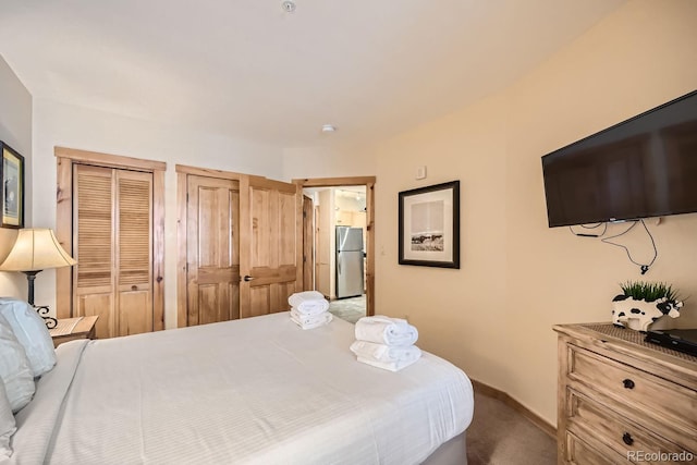 100 Dercum Sq Unit 8343, Keystone, CO 80435 - bedroom featuring freestanding refrigerator, carpet, two closets, and baseboards