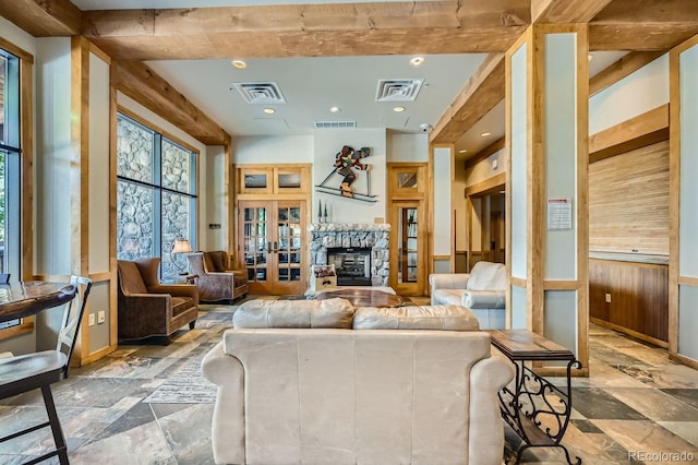 100 Dercum Sq Unit 8343, Keystone, CO 80435 - living room with french doors, wooden walls, recessed lighting, stone finish floors, and a fireplace