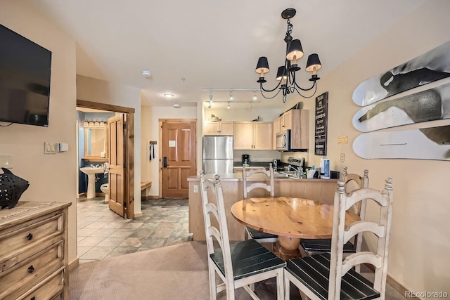 dining area featuring an inviting chandelier