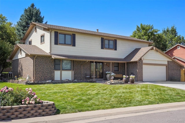 traditional-style home featuring a front lawn, an attached garage, brick siding, and concrete driveway