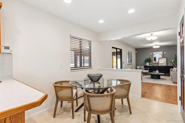 dining room featuring recessed lighting and baseboards