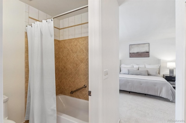 bathroom featuring ensuite bath, shower / tub combo, and toilet