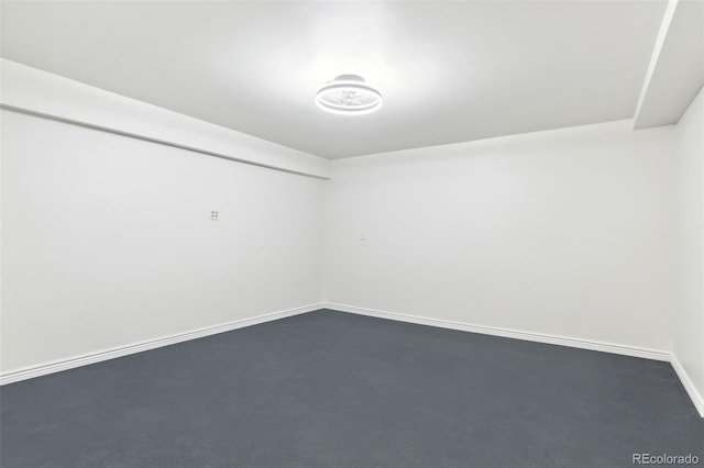 unfurnished room featuring baseboards