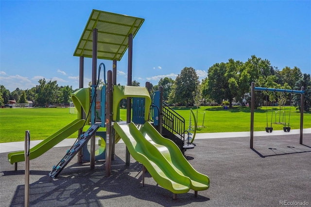 community jungle gym with a lawn