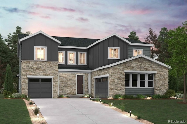 view of front of house with a garage, a front yard, board and batten siding, and concrete driveway