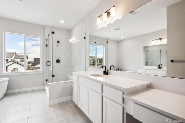 bathroom featuring tiled shower, tile patterned floors, a washtub, and baseboards