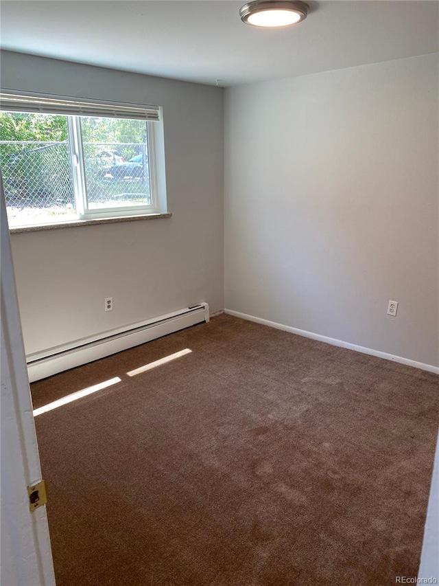 3760 Owens St, Wheat Ridge, CO 80033 - carpeted spare room featuring a baseboard radiator and baseboards