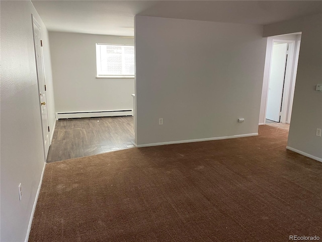 3760 Owens St, Wheat Ridge, CO 80033 - carpeted spare room with baseboard heating and baseboards