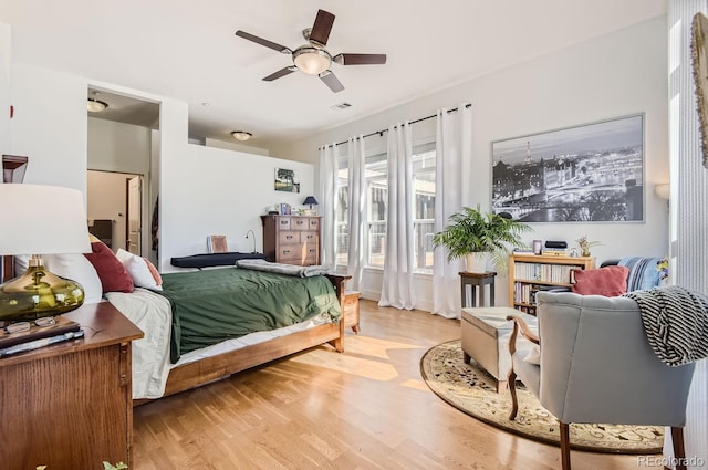 bedroom featuring visible vents and light wood-style flooring