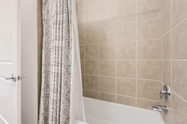 full bath featuring shower / tub combo with curtain