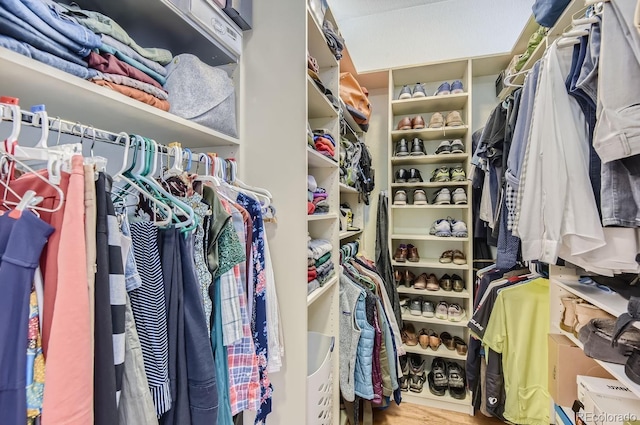 spacious closet with wood finished floors