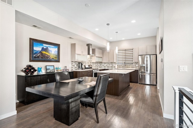 dining space with dark wood-type flooring, recessed lighting, visible vents, and baseboards