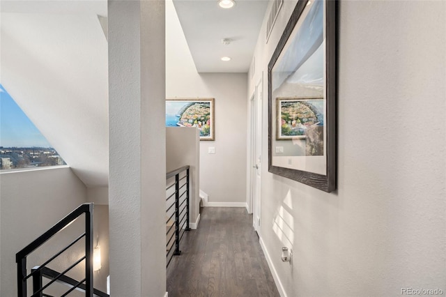 corridor featuring recessed lighting, visible vents, baseboards, and wood finished floors