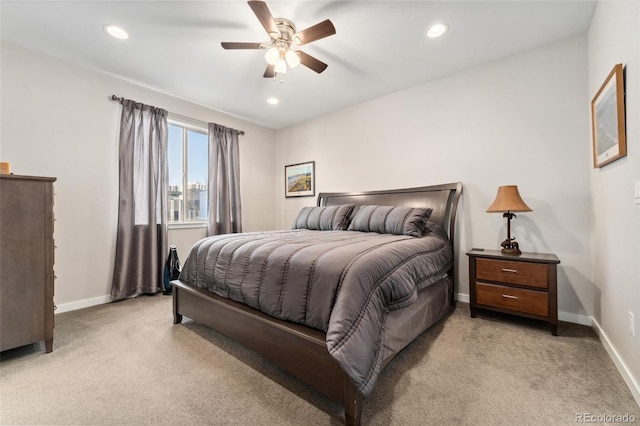 bedroom with a ceiling fan, recessed lighting, light colored carpet, and baseboards