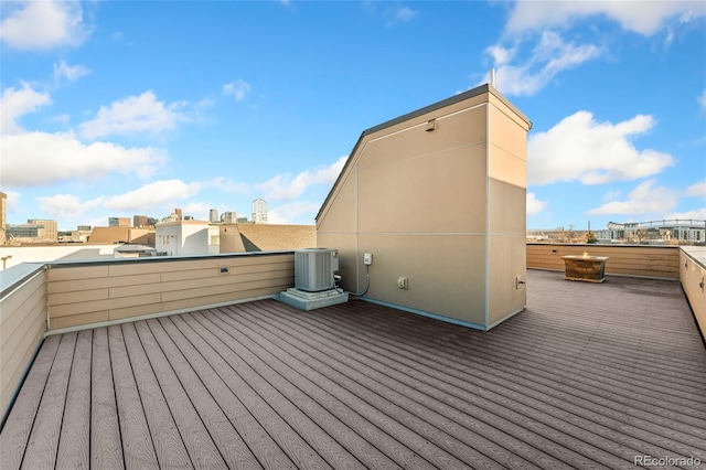 deck featuring a city view and central AC