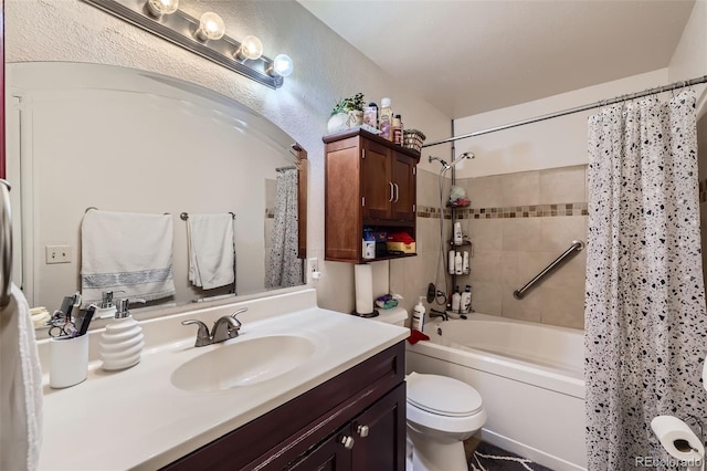 full bathroom featuring toilet, vanity, and shower / bath combination with curtain