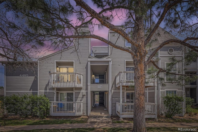 view of front of house featuring a balcony