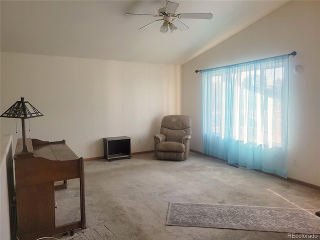 unfurnished room featuring carpet, vaulted ceiling, and ceiling fan