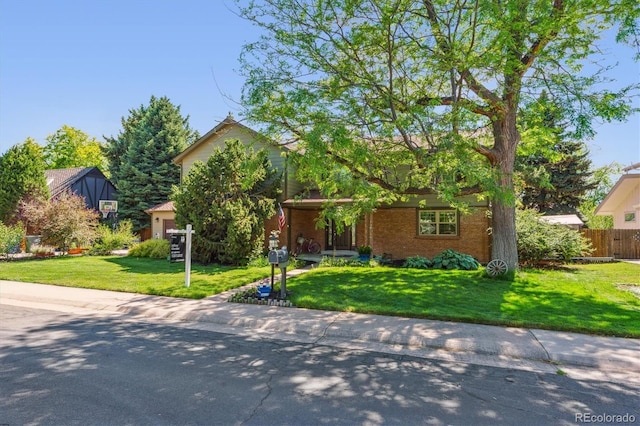 5755 S Fulton Way, Greenwood Village, CO 80111 - view of property hidden behind natural elements with brick siding