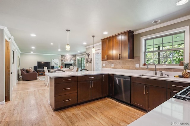 5755 S Fulton Way, Greenwood Village, CO 80111 - kitchen featuring stainless steel dishwasher, a peninsula, ornamental molding, light countertops, and plenty of natural light