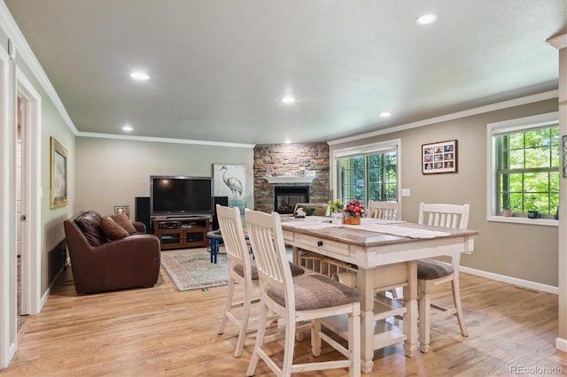 5755 S Fulton Way, Greenwood Village, CO 80111 - dining space with ornamental molding, recessed lighting, light wood-style floors, and a fireplace