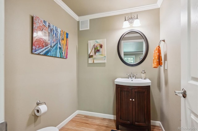 5755 S Fulton Way, Greenwood Village, CO 80111 - bathroom featuring wood finished floors, crown molding, and vanity