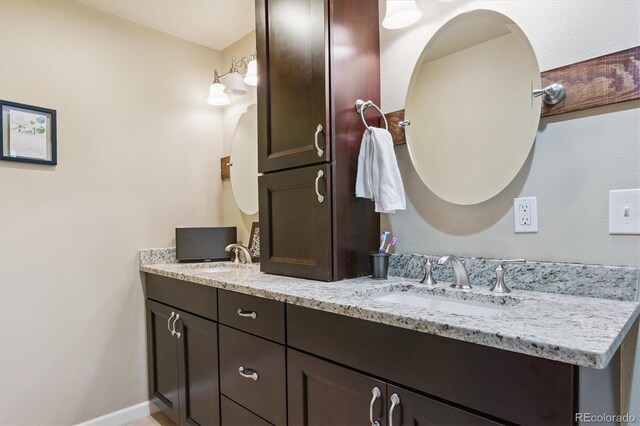 5755 S Fulton Way, Greenwood Village, CO 80111 - bathroom featuring double vanity