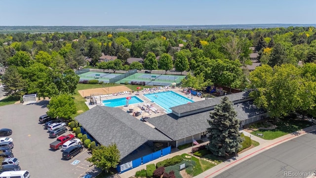 5755 S Fulton Way, Greenwood Village, CO 80111 - drone / aerial view of a pool and a heavily wooded area