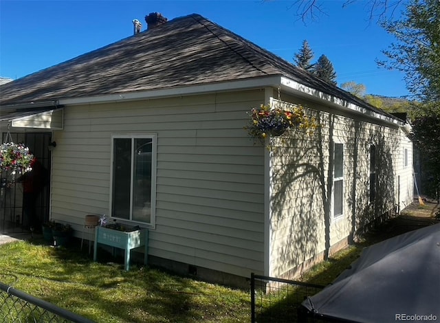 view of property exterior with a lawn