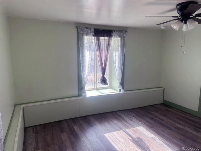 empty room featuring ceiling fan and hardwood / wood-style floors