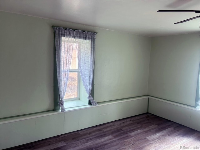 unfurnished room featuring hardwood / wood-style floors and ceiling fan