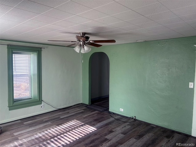 spare room with ceiling fan and dark hardwood / wood-style floors