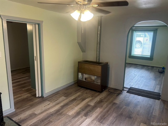 unfurnished living room featuring hardwood / wood-style floors and ceiling fan