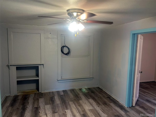 spare room featuring ceiling fan and dark hardwood / wood-style flooring