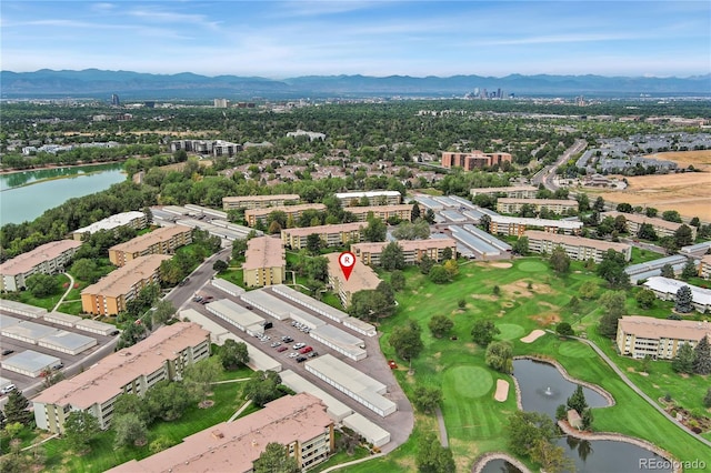 drone / aerial view with a water and mountain view