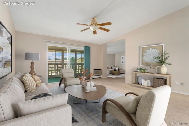 living room featuring an AC wall unit, ceiling fan, light colored carpet, and lofted ceiling