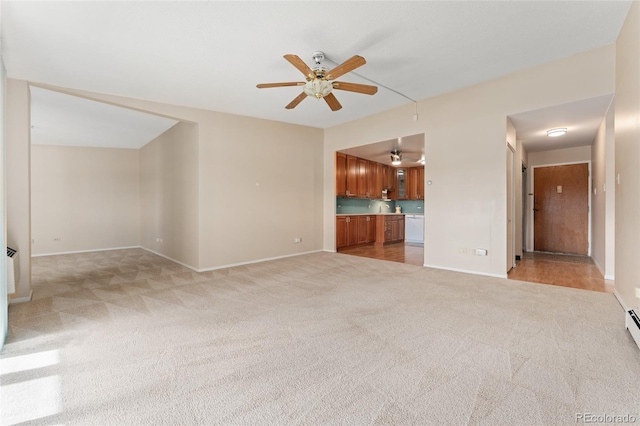 unfurnished living room with ceiling fan and light colored carpet