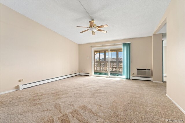 empty room featuring a textured ceiling, ceiling fan, light carpet, and a baseboard heating unit