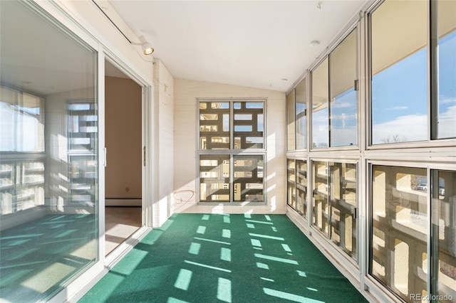 interior space featuring baseboard heating and vaulted ceiling