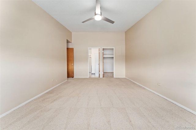 unfurnished bedroom featuring a closet, ceiling fan, and light colored carpet