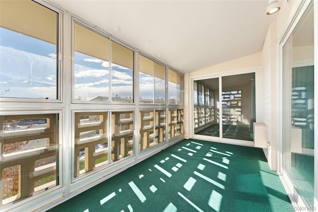 unfurnished sunroom with vaulted ceiling