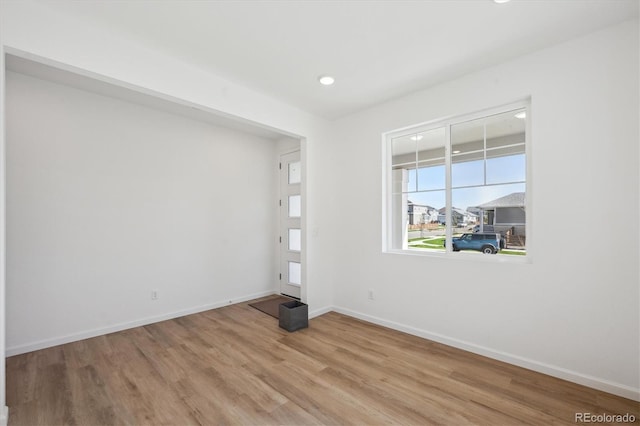 1331 Rock Cliff Ave, Erie, CO 80516 - empty room featuring baseboards, light wood-type flooring, and recessed lighting