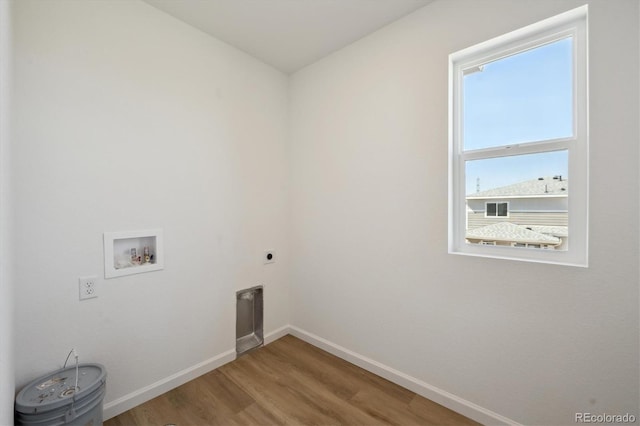 1331 Rock Cliff Ave, Erie, CO 80516 - washroom with wood finished floors, laundry area, electric dryer hookup, washer hookup, and baseboards