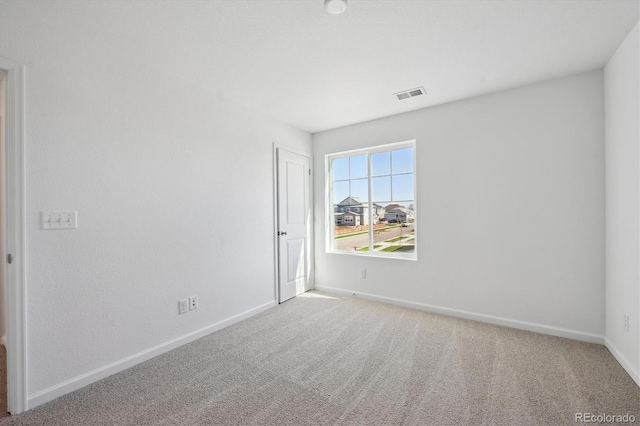 1331 Rock Cliff Ave, Erie, CO 80516 - unfurnished room with visible vents, baseboards, and light carpet