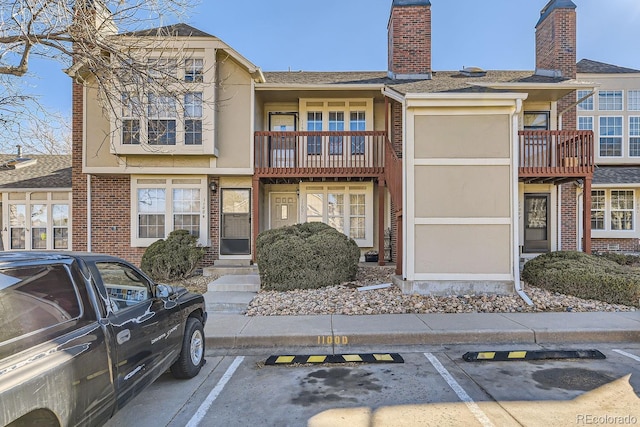 view of property featuring uncovered parking