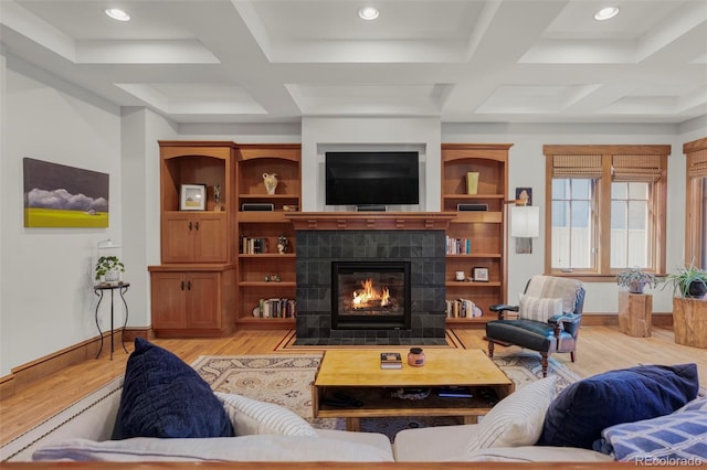 1143 S Saint Paul St, Denver, CO 80210 - living room featuring coffered ceiling, light wood-style floors, a fireplace, baseboards, and beam ceiling