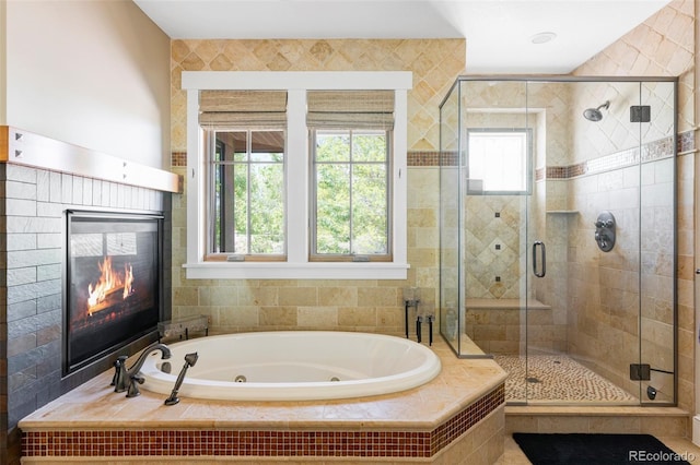 1143 S Saint Paul St, Denver, CO 80210 - bathroom featuring a shower stall, a jetted tub, and a fireplace